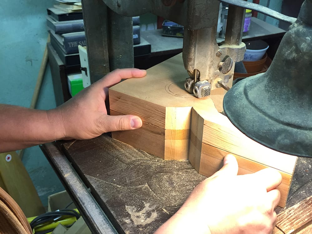 Finishing the scroll on the band saw.