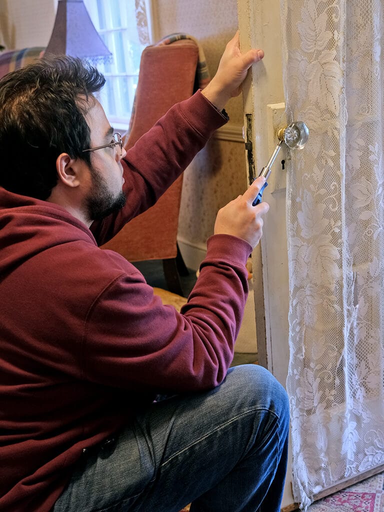 Jeff Lasky repairing an an antique door
