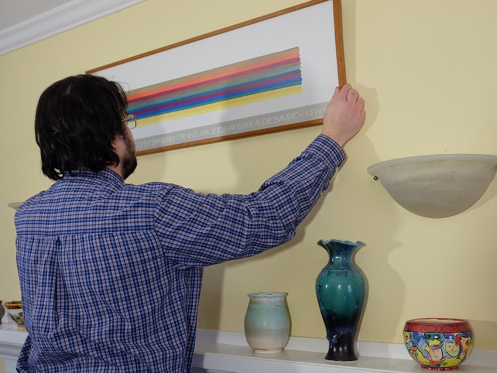 Finishing touches include hanging a painting or picture straight.