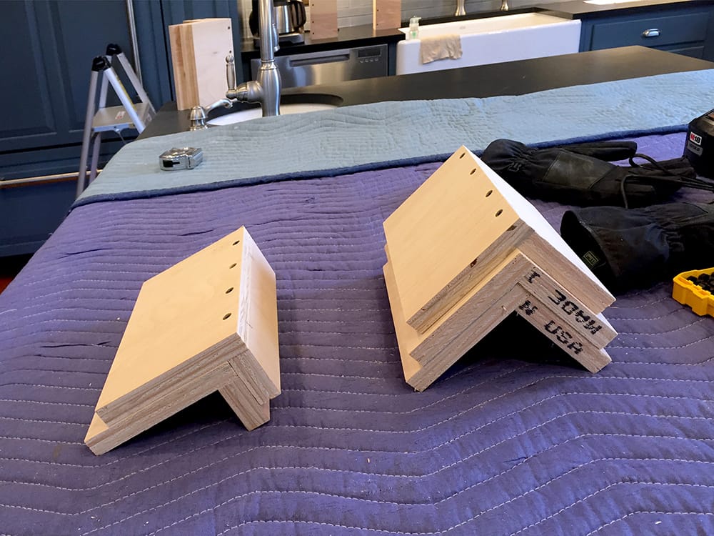 We fabricated corners to be installed on the cabinet tops to provide support for the trim.