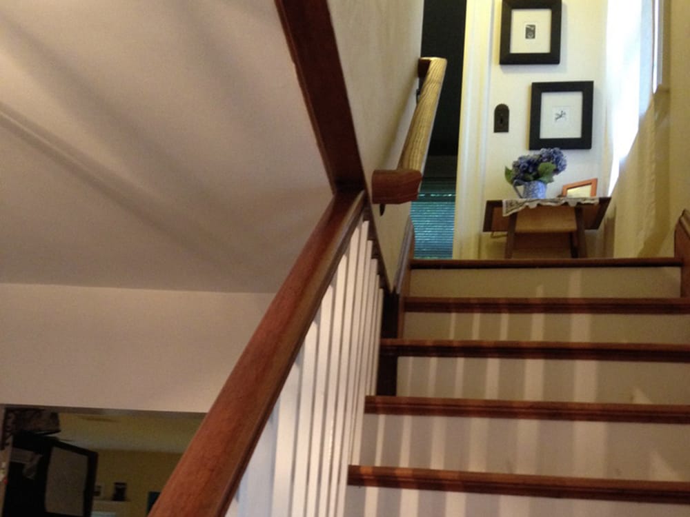 The original railing went only part way up the stairs. We added the railing (shown) that continues to the top of the stairs.