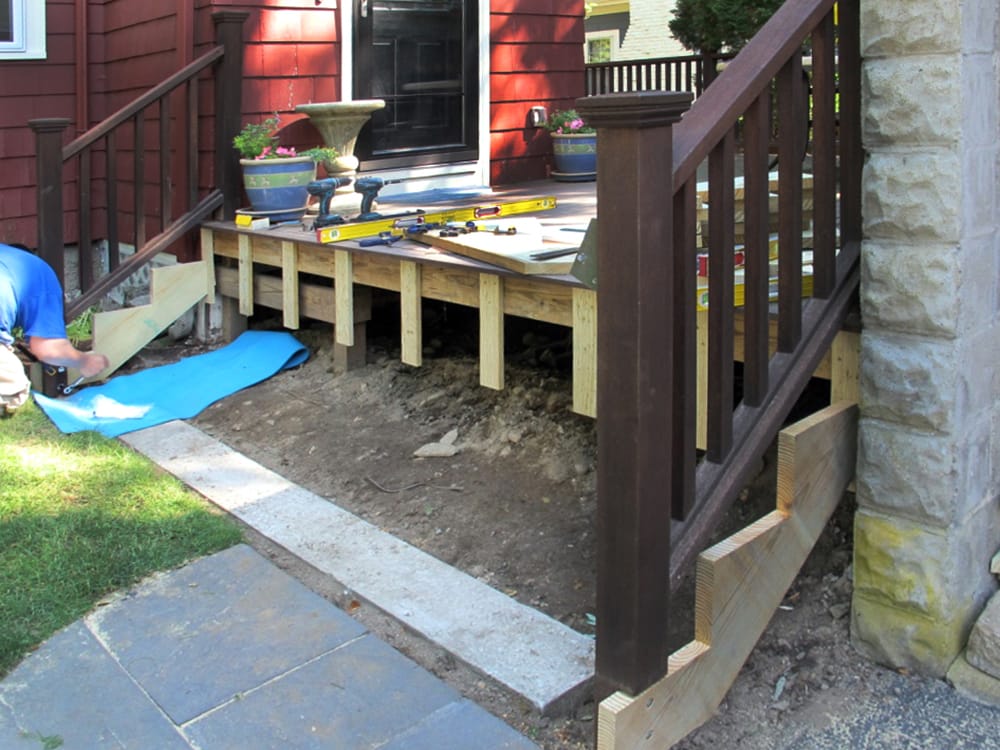 We found that the builder had set the stringers in the dirt. We poured a new concrete footing.