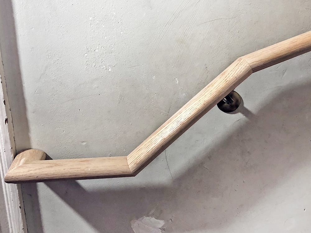 A view of the railing at the start of the stairs.