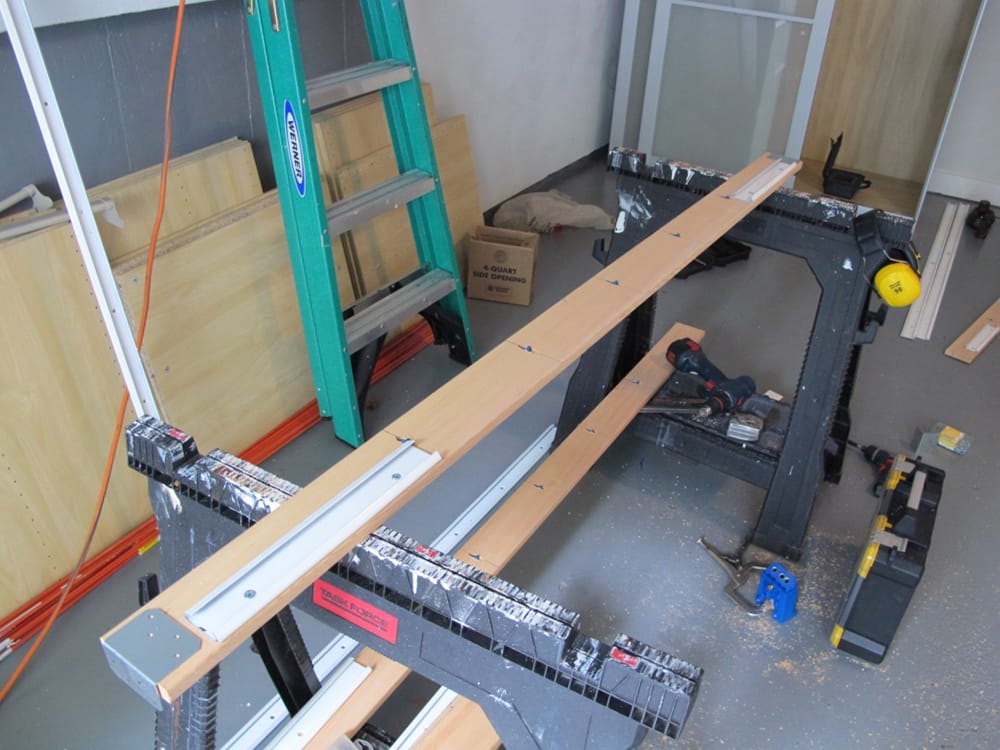 We built a rail, with clips, that would be attached to the piece.