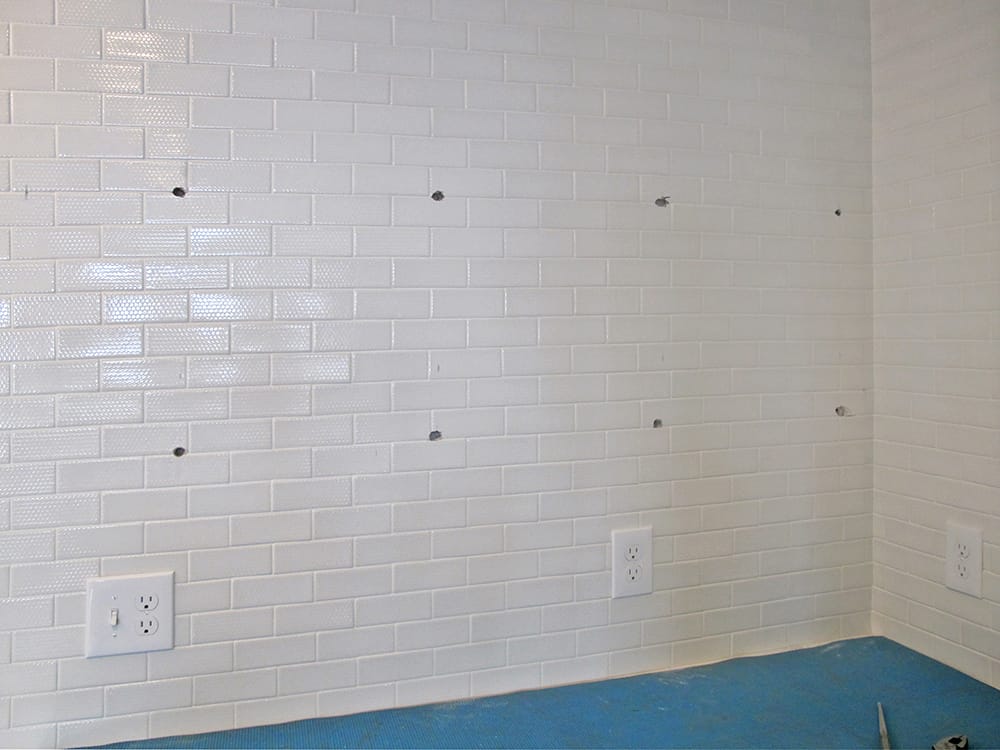 Eight holes for two shelves.