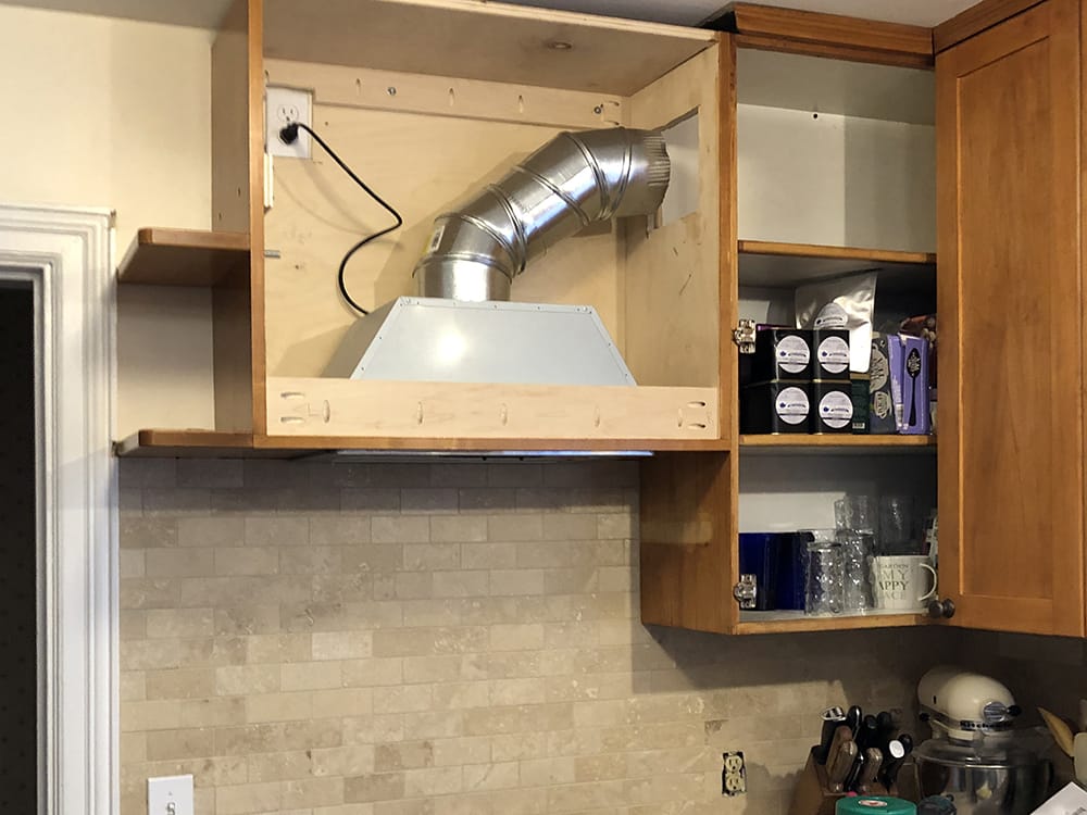 Cabinet installation in progress. (Doors are on order.) The venting has to be completed.