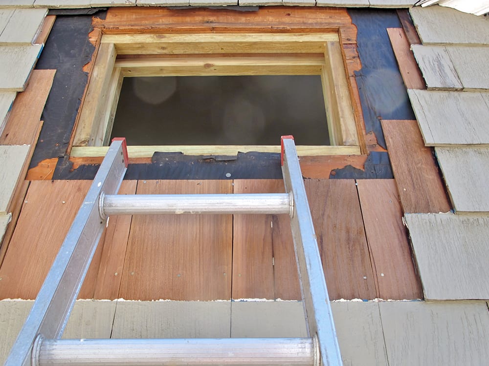 We removed shingles so that we could weave in new ones. (No photo for the framing.)