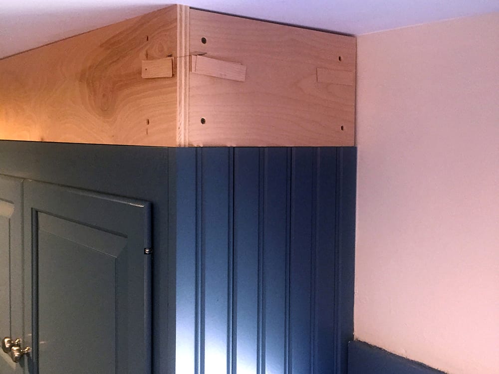 Plywood backers were installed flush with the cabinet faces to support the facia boards.