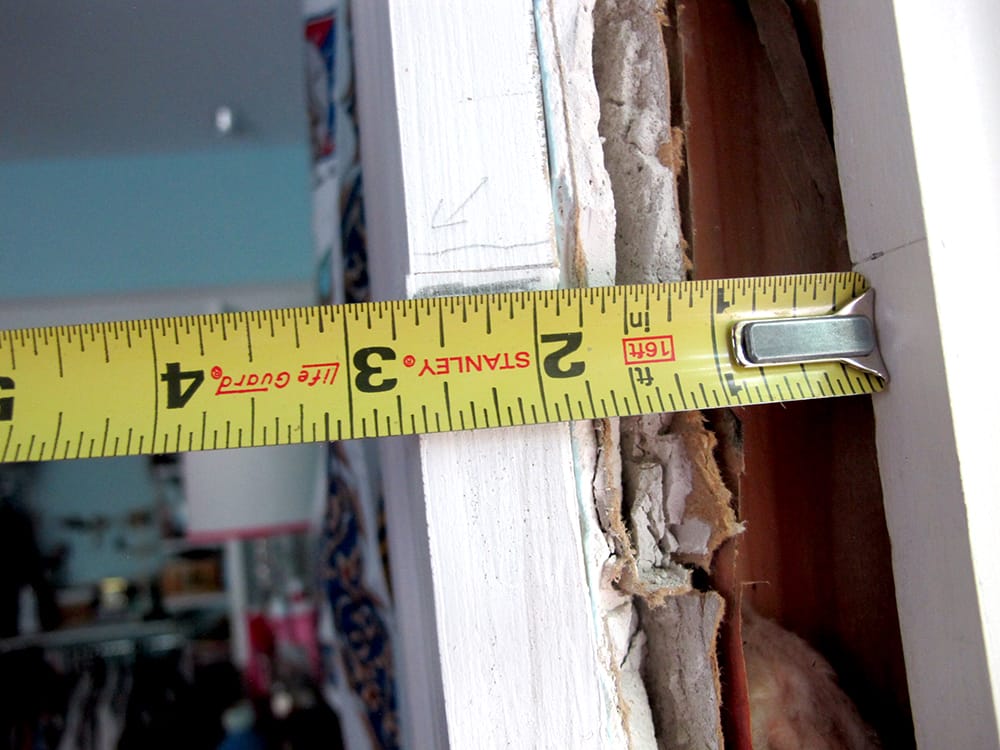 On the right side, it was 2-5/8” away. (Reading the tape upside down.) The wall was bowed!