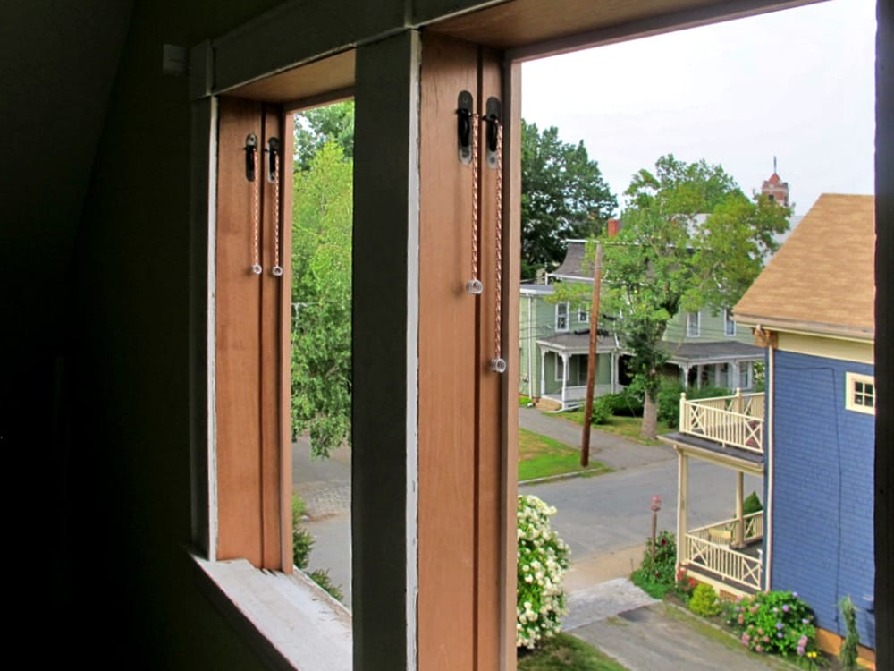 The new jambs installed. We used copper plated steel chain to attach the counter weights.