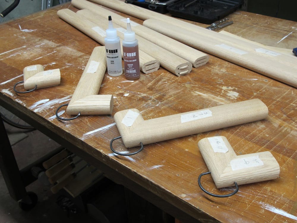 The returns (into the wall) for each end of the railings are glued up and clamped.